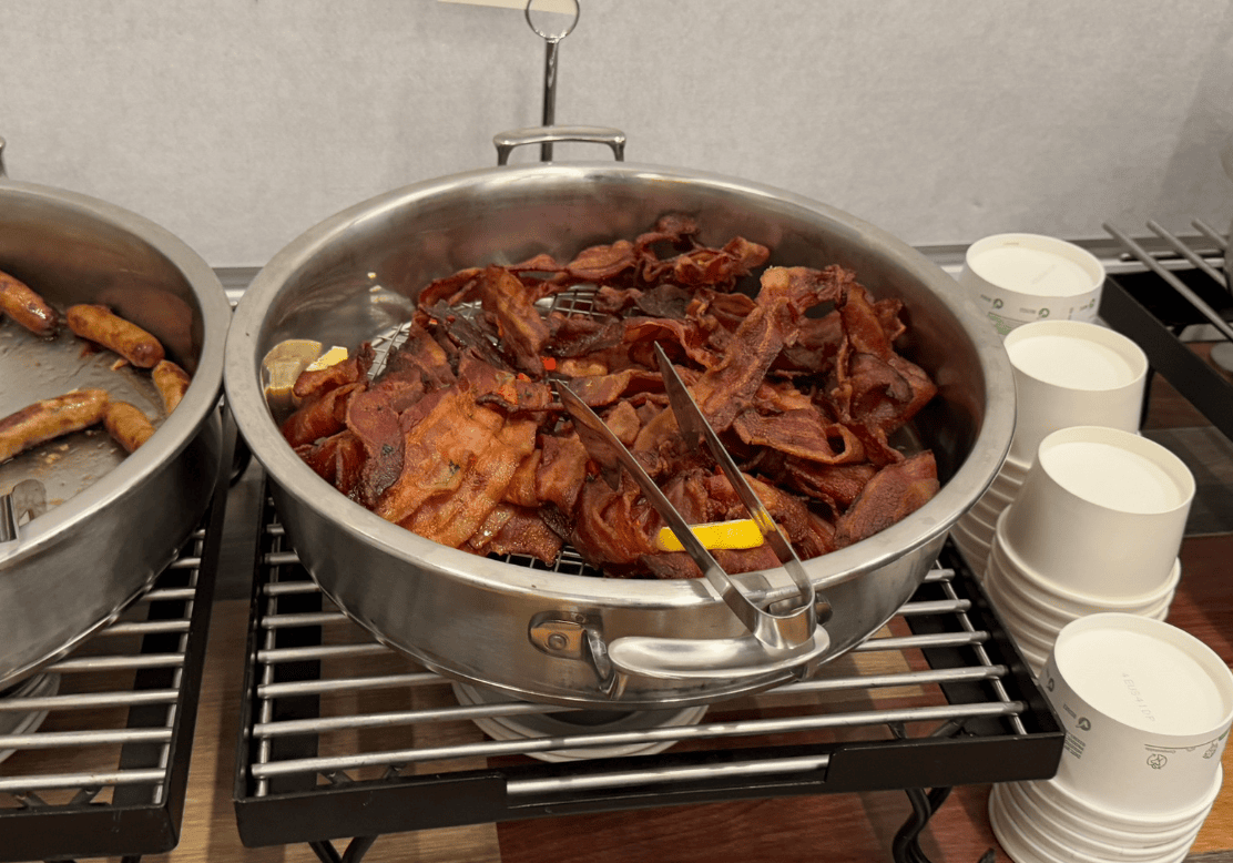 A bowl of bacon on a rack

Description automatically generated