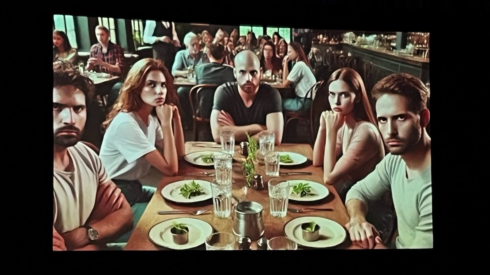 A group of people sitting at a table

Description automatically generated
