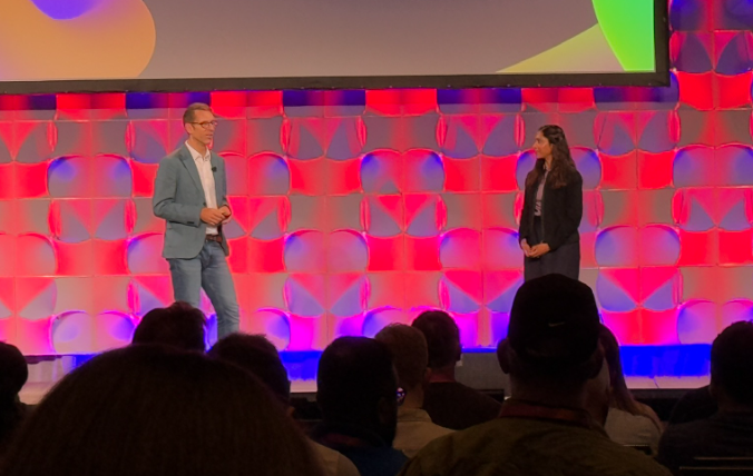 A person and person on stage

Description automatically generated