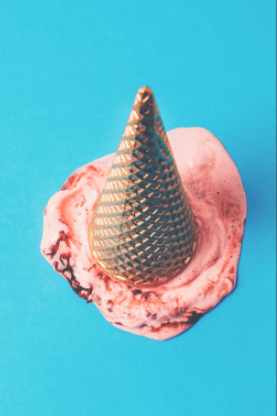 spilled ice cream cone with golden cone-- looks a bit like a unicorn horn